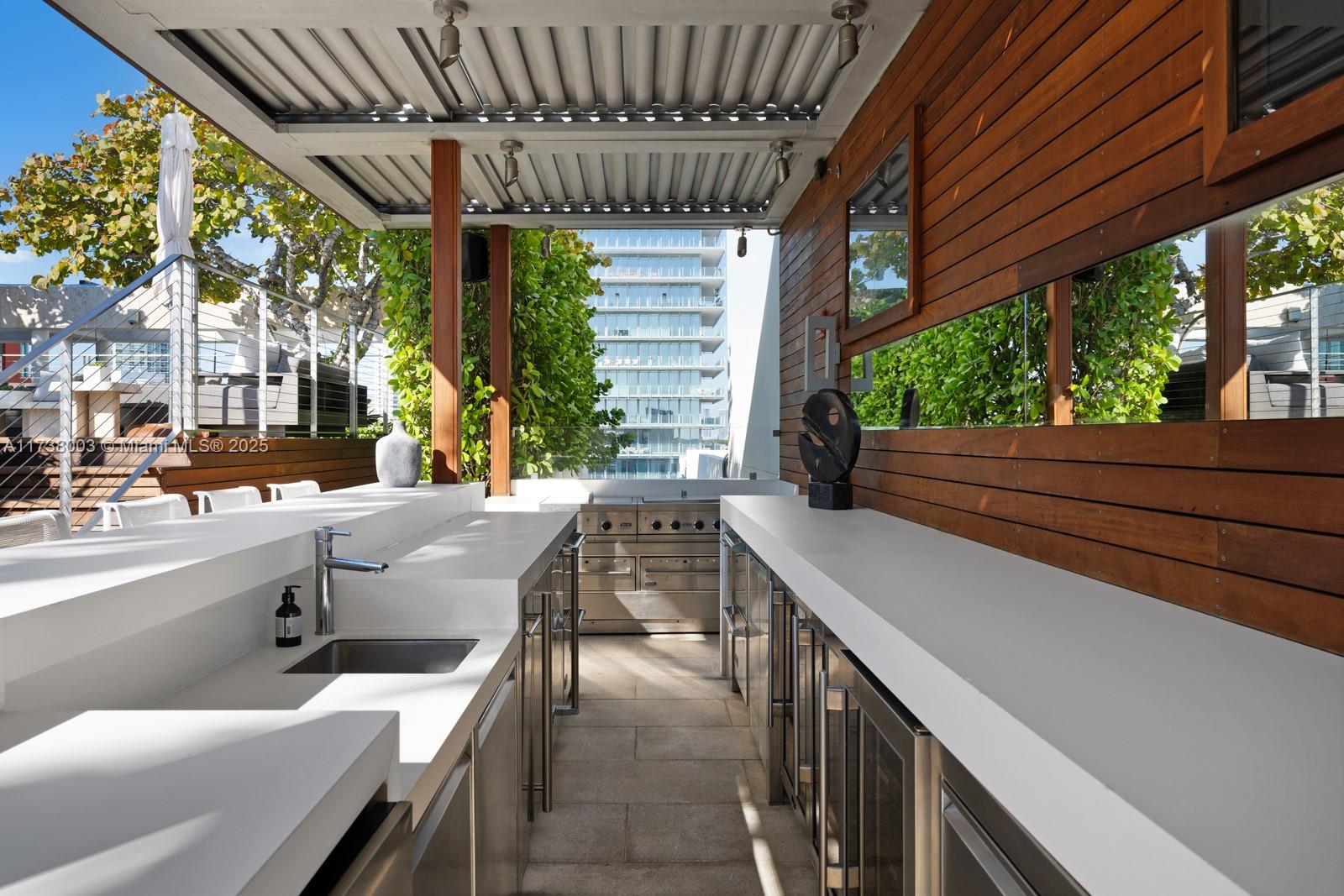 125 Ocean Drive, Unit PH Miami Beach, FL 33139 - Photo 50 of 56 a balcony with furniture and a large window