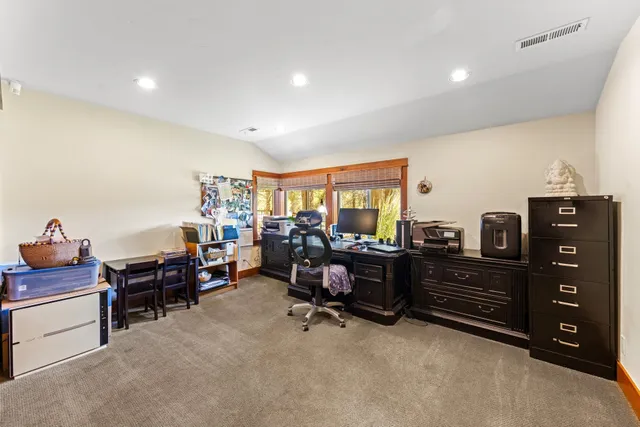 a view of a workspace with furniture