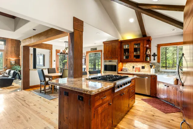 a kitchen with a stove a sink and a refrigerator