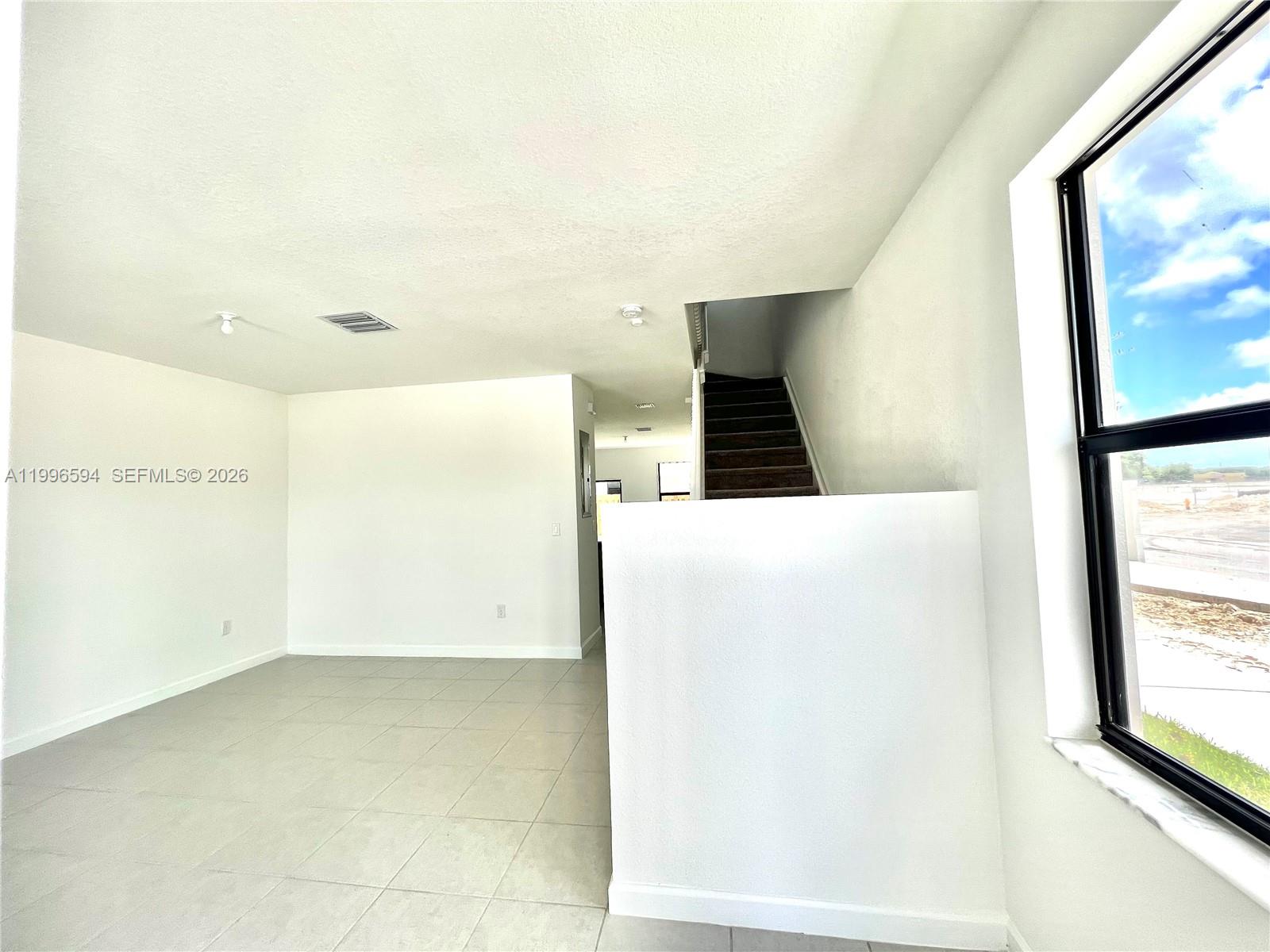 23373 Southwest 129th Path, Unit 23373 Homestead, FL 33032 - Photo 3 of 18 a view of a room with a large window