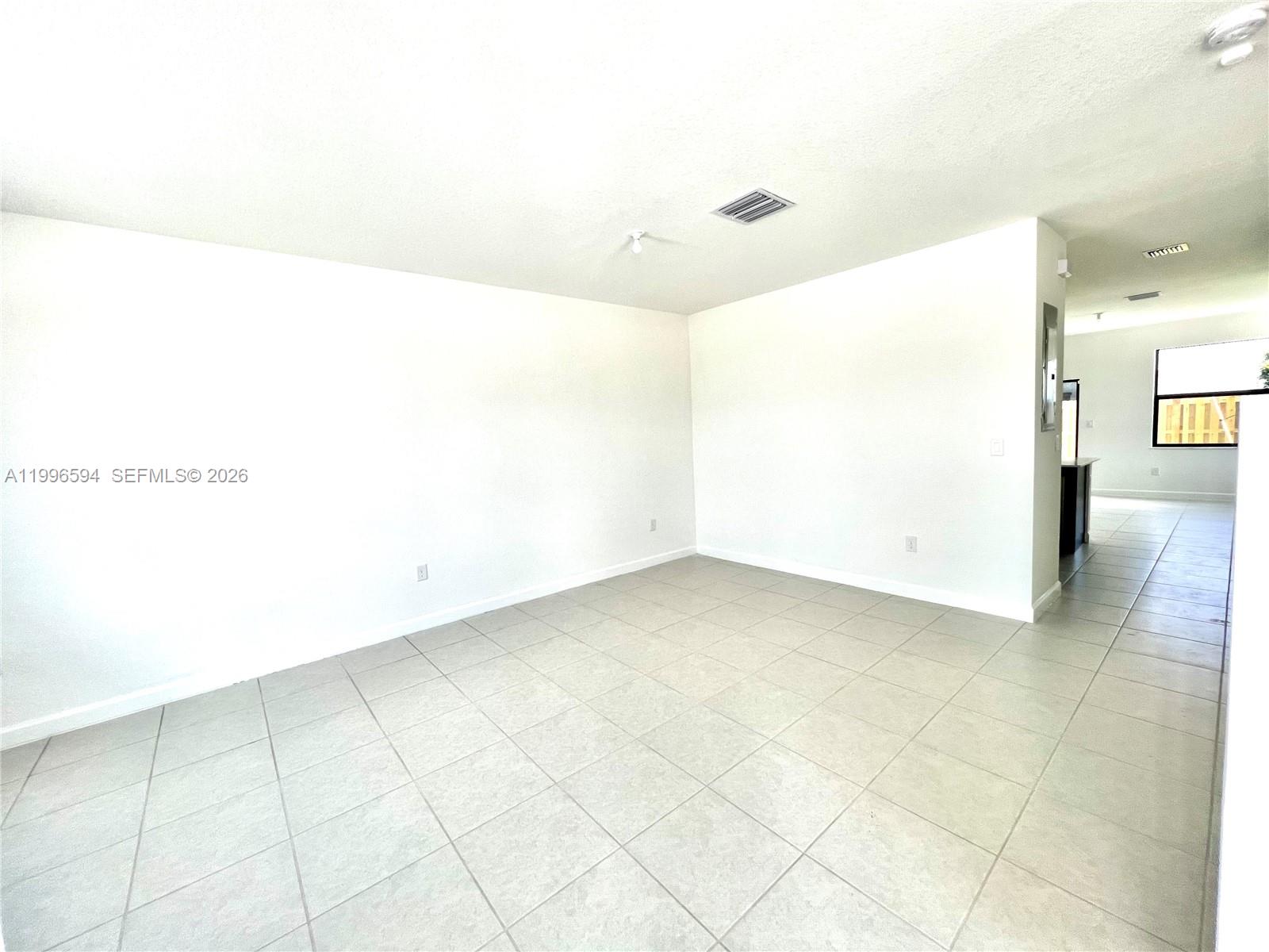 23373 Southwest 129th Path, Unit 23373 Homestead, FL 33032 - Photo 4 of 18 a view of a room with an empty space