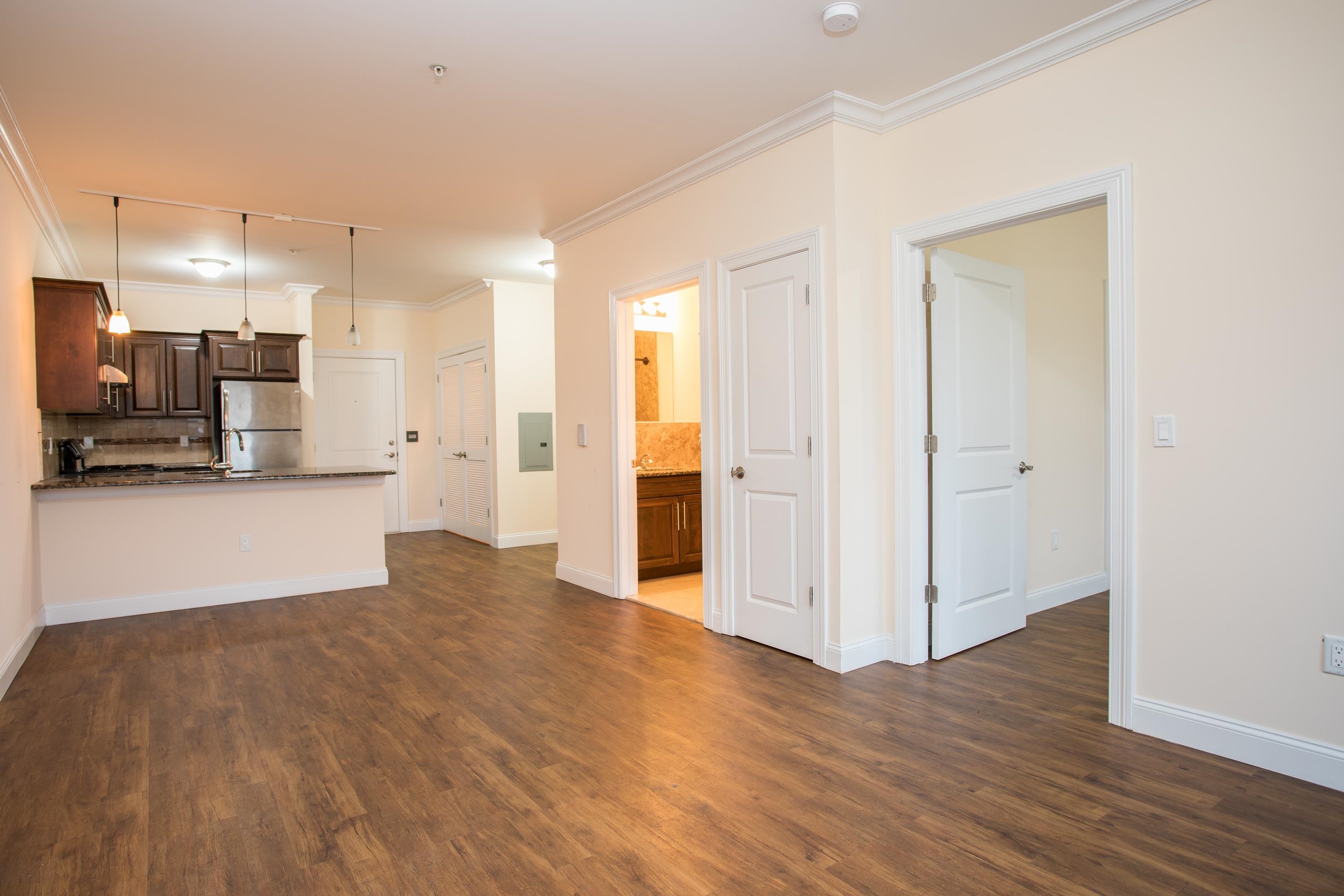 6111 Fillmore Place, Unit 306 West New York, NJ 07093 - Photo 26 of 27 a view of a kitchen with a refrigerator and a stove top oven