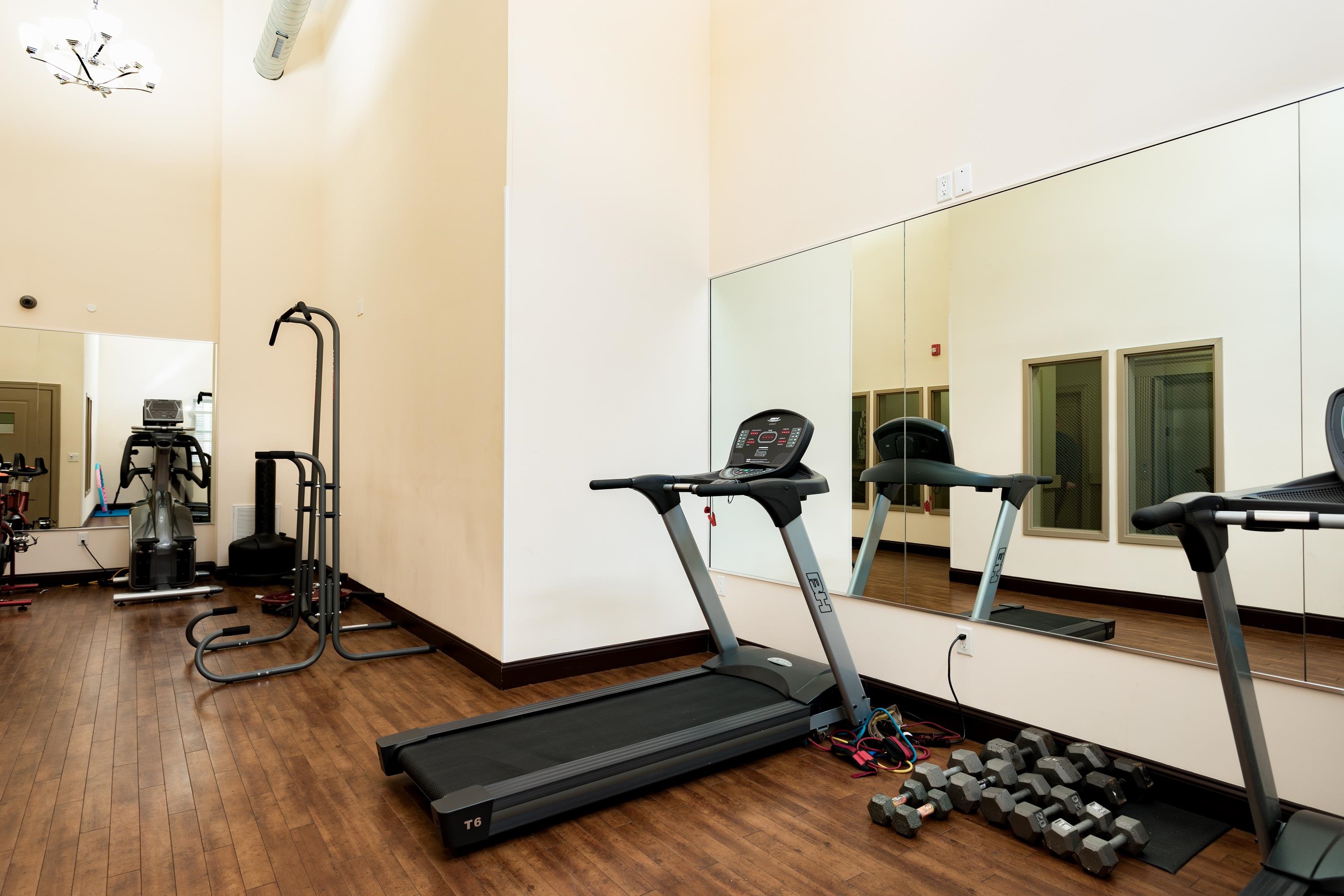 6111 Fillmore Place, Unit 306 West New York, NJ 07093 - Photo 4 of 27 a living room with furniture gym equipment and a view of living room