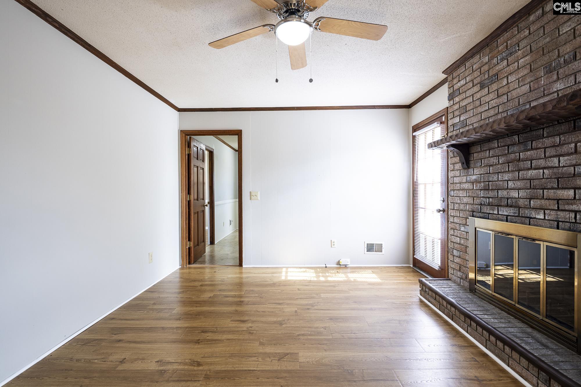 4083 Platt Springs Road West Columbia, SC 29170 - Photo 15 of 35 a view of an empty room with window and wooden floor