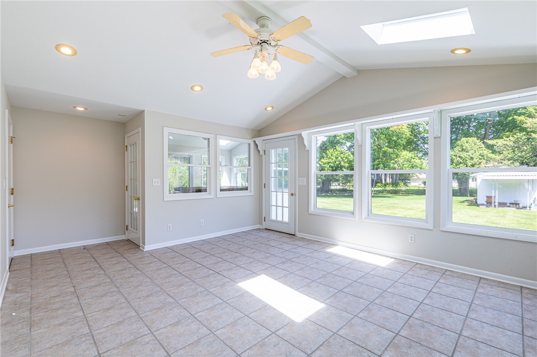274 Parkview Drive Rochester, NY 14625 - Photo 15 of 41 Second sunroom view of backyard