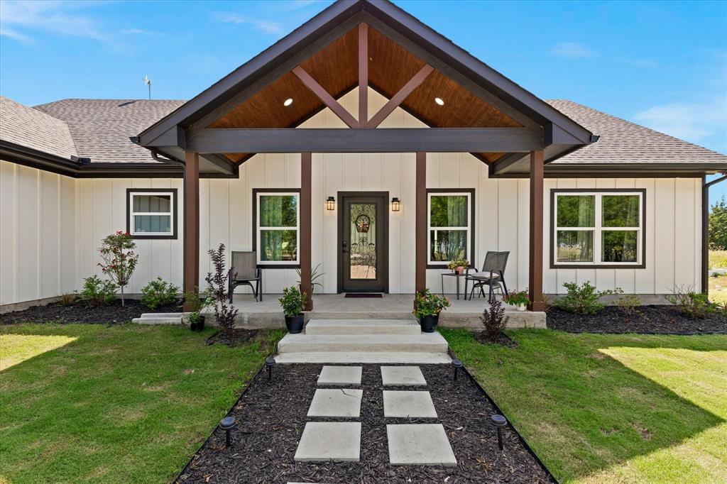 710 Valek Road Ennis, TX 75119 - Photo 1 of 40 a front view of a house with garden