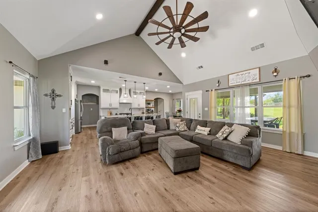 a living room with furniture and a large window