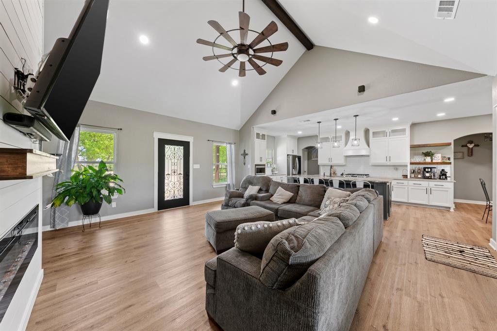 710 Valek Road Ennis, TX 75119 - Photo 12 of 40 a living room with furniture and a chandelier