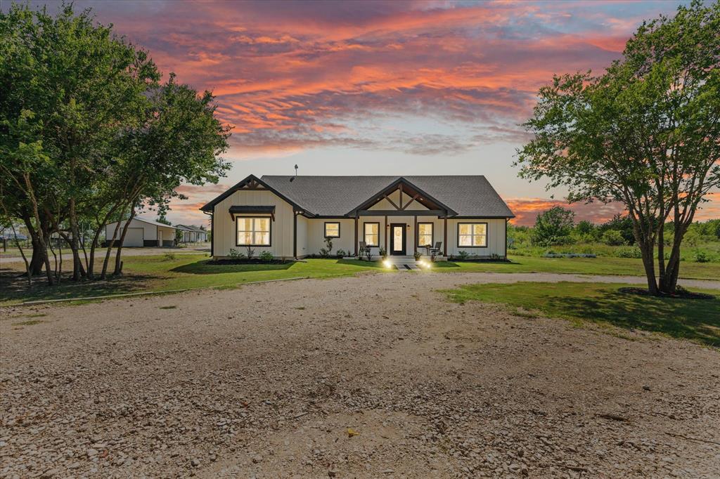 710 Valek Road Ennis, TX 75119 - Photo 2 of 40 a view of house with garden