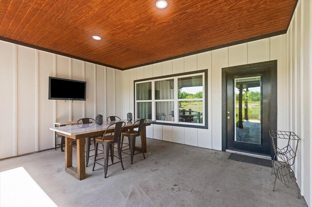 710 Valek Road Ennis, TX 75119 - Photo 34 of 40 a view of a dining room with furniture and window