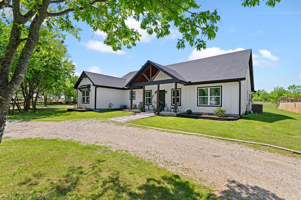 710 Valek Road Ennis, TX 75119 - Photo 6 of 40 a house with swimming pool in front of it