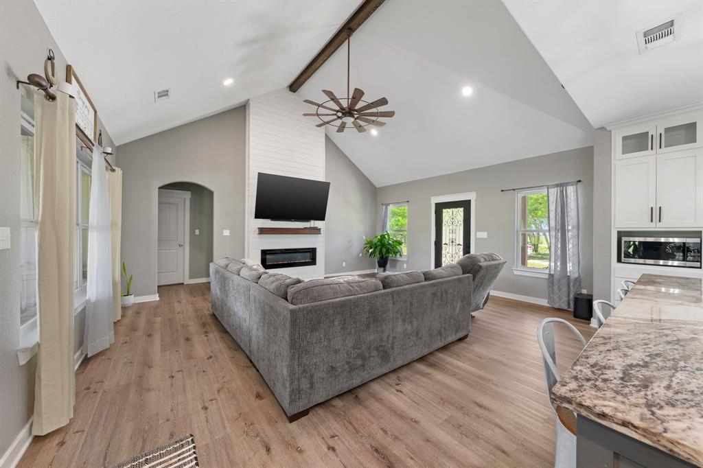 710 Valek Road Ennis, TX 75119 - Photo 9 of 40 a living room with furniture and a flat screen tv