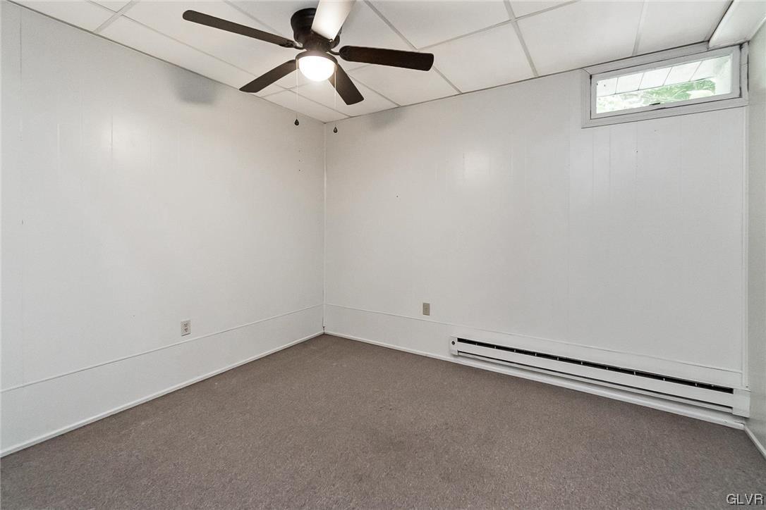 37 Germanville Road Ashland, PA 17921 - Photo 34 of 48 an empty room with a ceiling fan and carpet