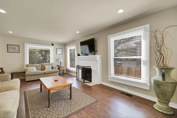 a kitchen with kitchen island a dining table and chairs