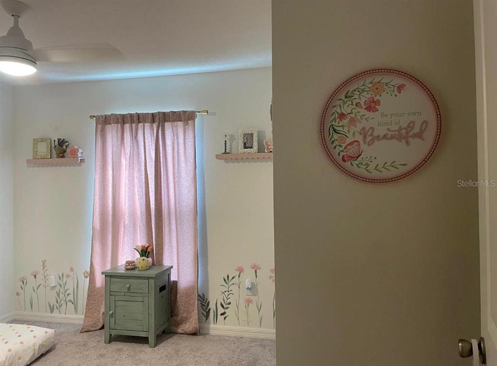 1446 Geranium Drive Mascotte, FL 34753 - Photo 13 of 24 a view of a hallway with entryway door