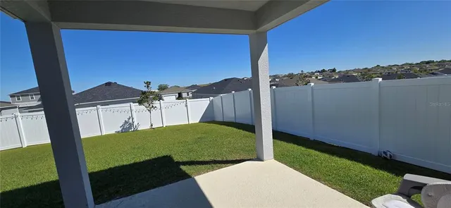a view of backyard with cabin