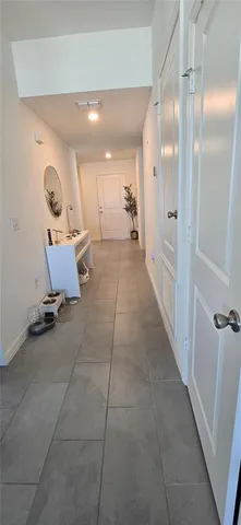 a room with furniture and a mirror