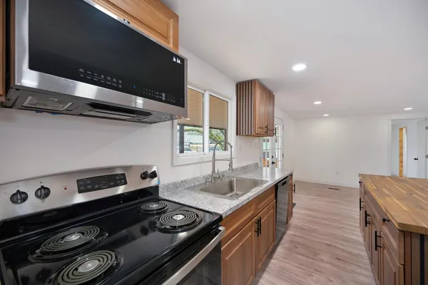 a kitchen with a stove and a microwave