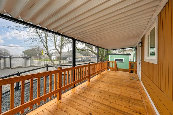 a view of porch with wooden floor