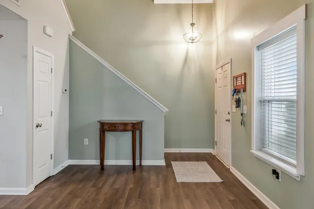 a bedroom with a bed and a tv