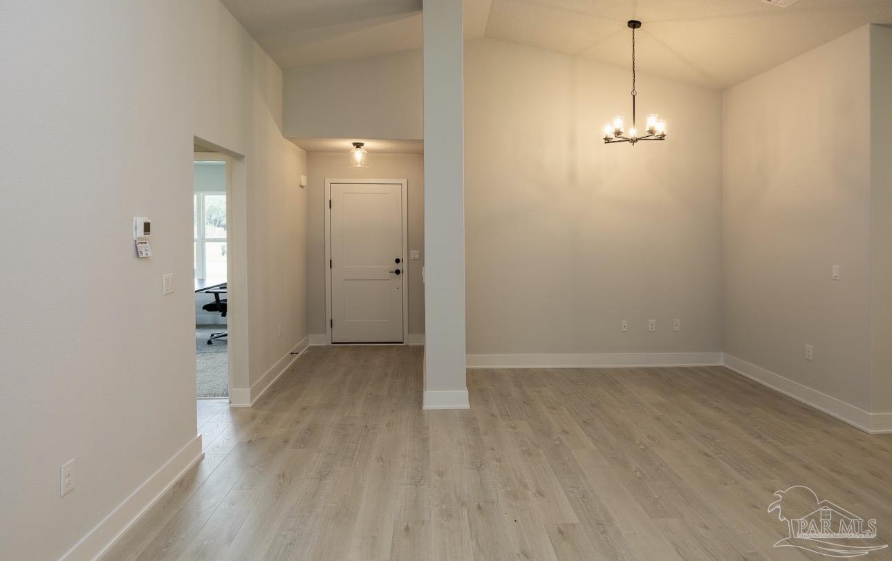 7657 Small Pnes Street Milton, FL 32583 - Photo 5 of 26 a view of a room with wooden floor