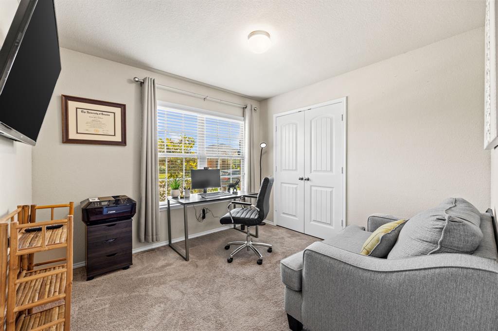 3010 Rosemount Lane Forney, TX 75126 - Photo 19 of 33 a living room with furniture and a flat screen tv