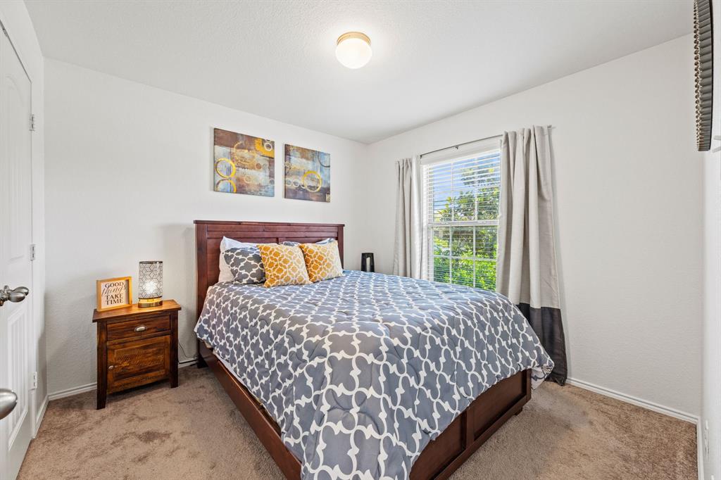 3010 Rosemount Lane Forney, TX 75126 - Photo 21 of 33 a bedroom with a bed and window
