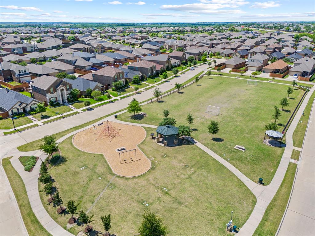 3010 Rosemount Lane Forney, TX 75126 - Photo 29 of 33 an aerial view of a swimming pool with a yard and mountain view in back