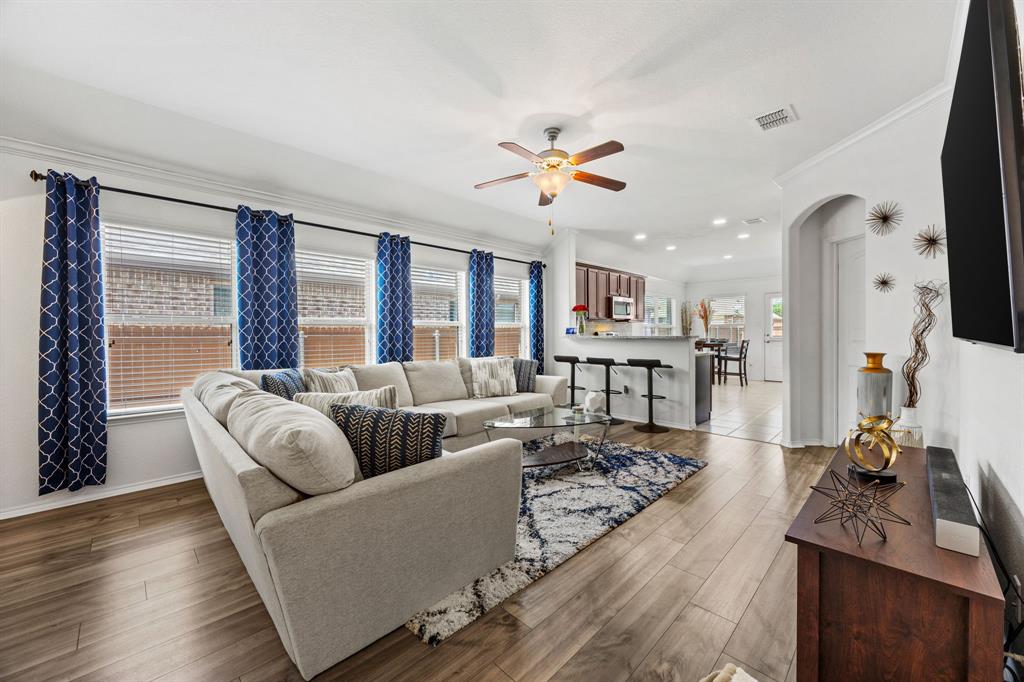 3010 Rosemount Lane Forney, TX 75126 - Photo 4 of 33 a living room with furniture fireplace and a large window