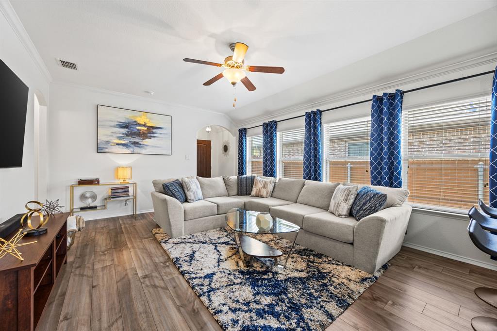 3010 Rosemount Lane Forney, TX 75126 - Photo 5 of 33 a living room with furniture two large window and a flat screen tv
