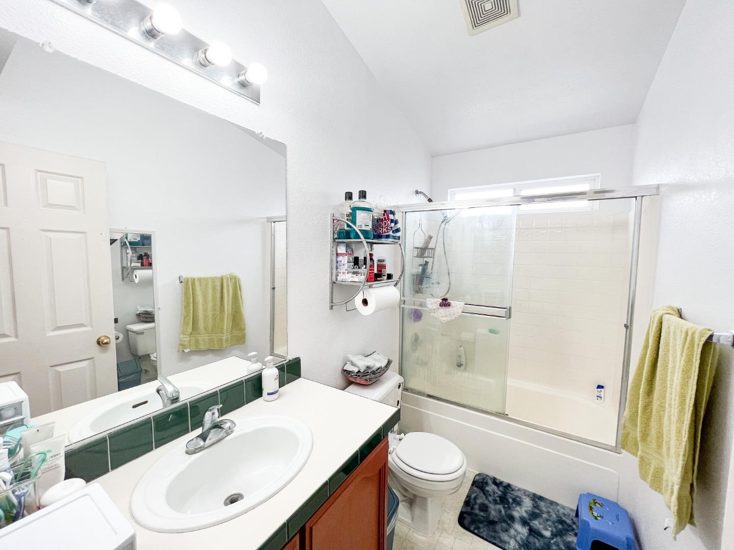 555 Umbarger Road, Unit 30 San Jose, CA 95111 - Photo 12 of 15 a bathroom with a sink toilet and shower