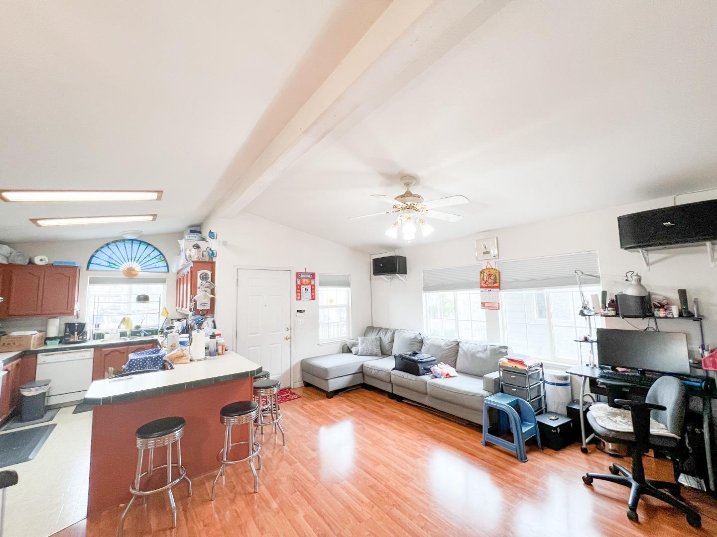 555 Umbarger Road, Unit 30 San Jose, CA 95111 - Photo 2 of 15 a living room with furniture and a flat screen tv