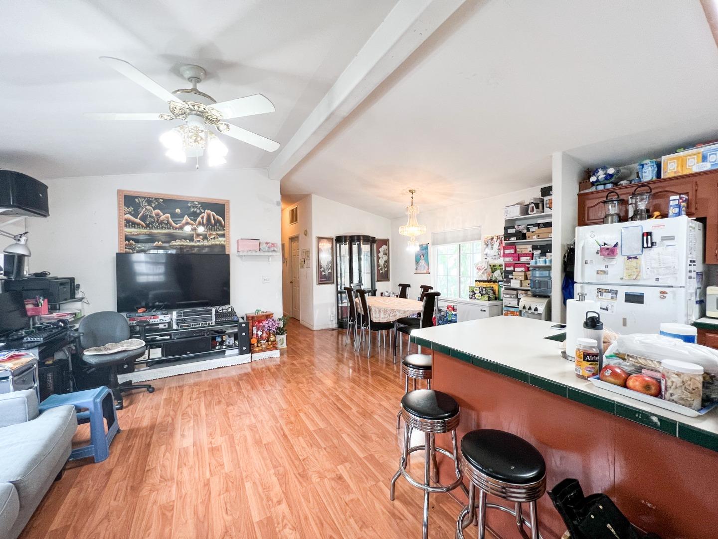 555 Umbarger Road, Unit 30 San Jose, CA 95111 - Photo 6 of 15 a living room with furniture and wooden floor