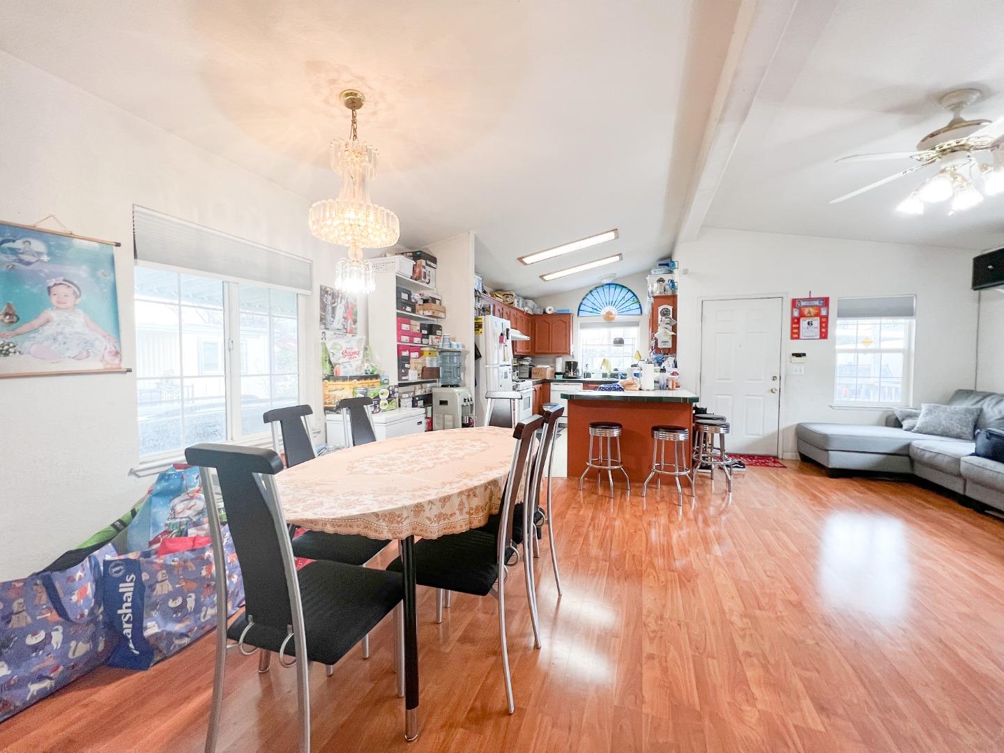 555 Umbarger Road, Unit 30 San Jose, CA 95111 - Photo 8 of 15 a living room with furniture and wooden floor