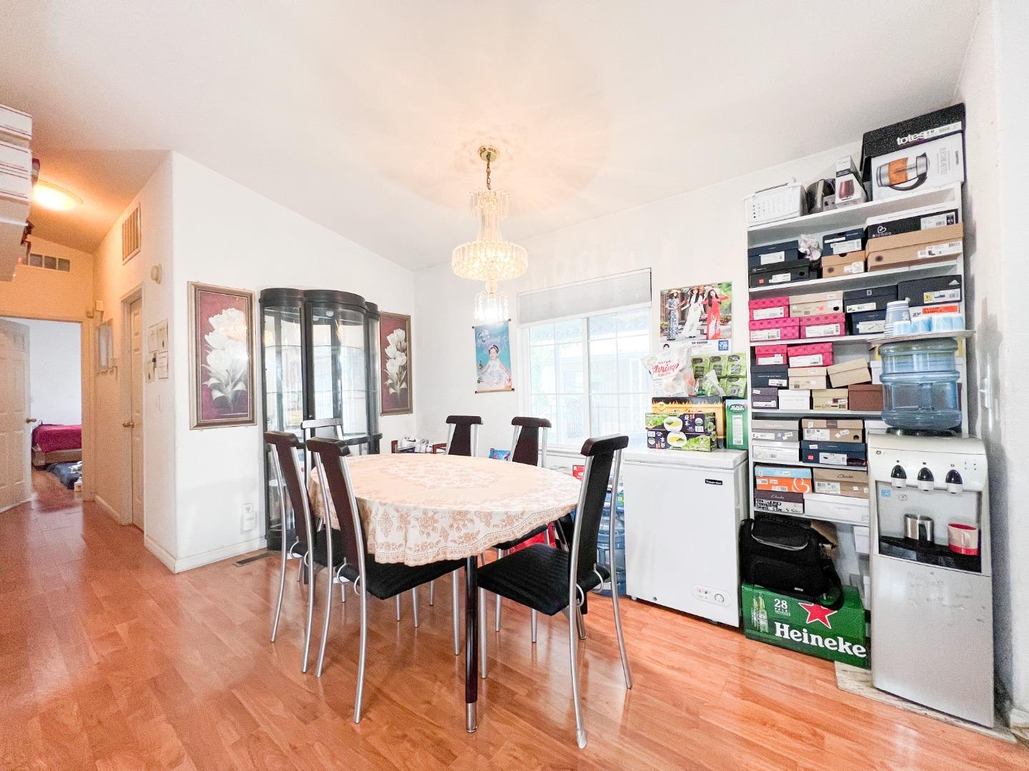 555 Umbarger Road, Unit 30 San Jose, CA 95111 - Photo 9 of 15 a view of a dining room with furniture and wooden floor