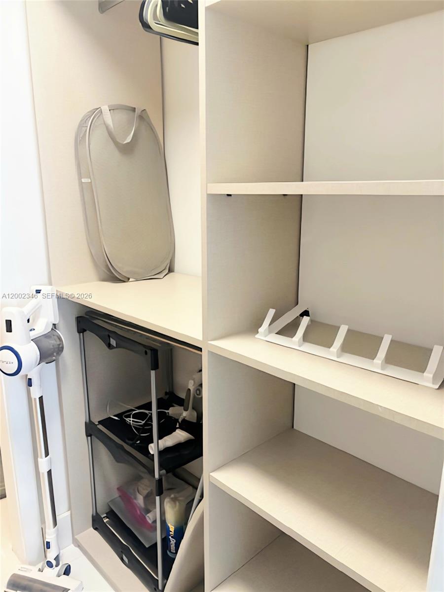 100 Lincoln Road, Unit 927 Miami Beach, FL 33139 - Photo 14 of 42 a utility room with dryer and washer