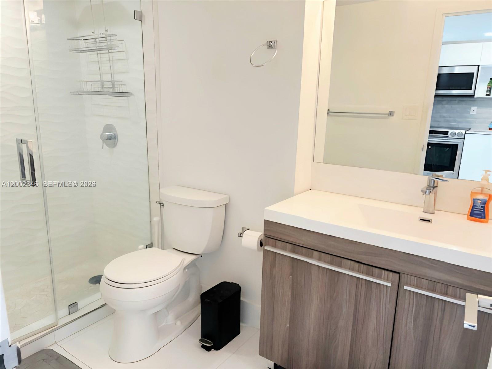 100 Lincoln Road, Unit 927 Miami Beach, FL 33139 - Photo 16 of 42 a bathroom with a sink a toilet and shower