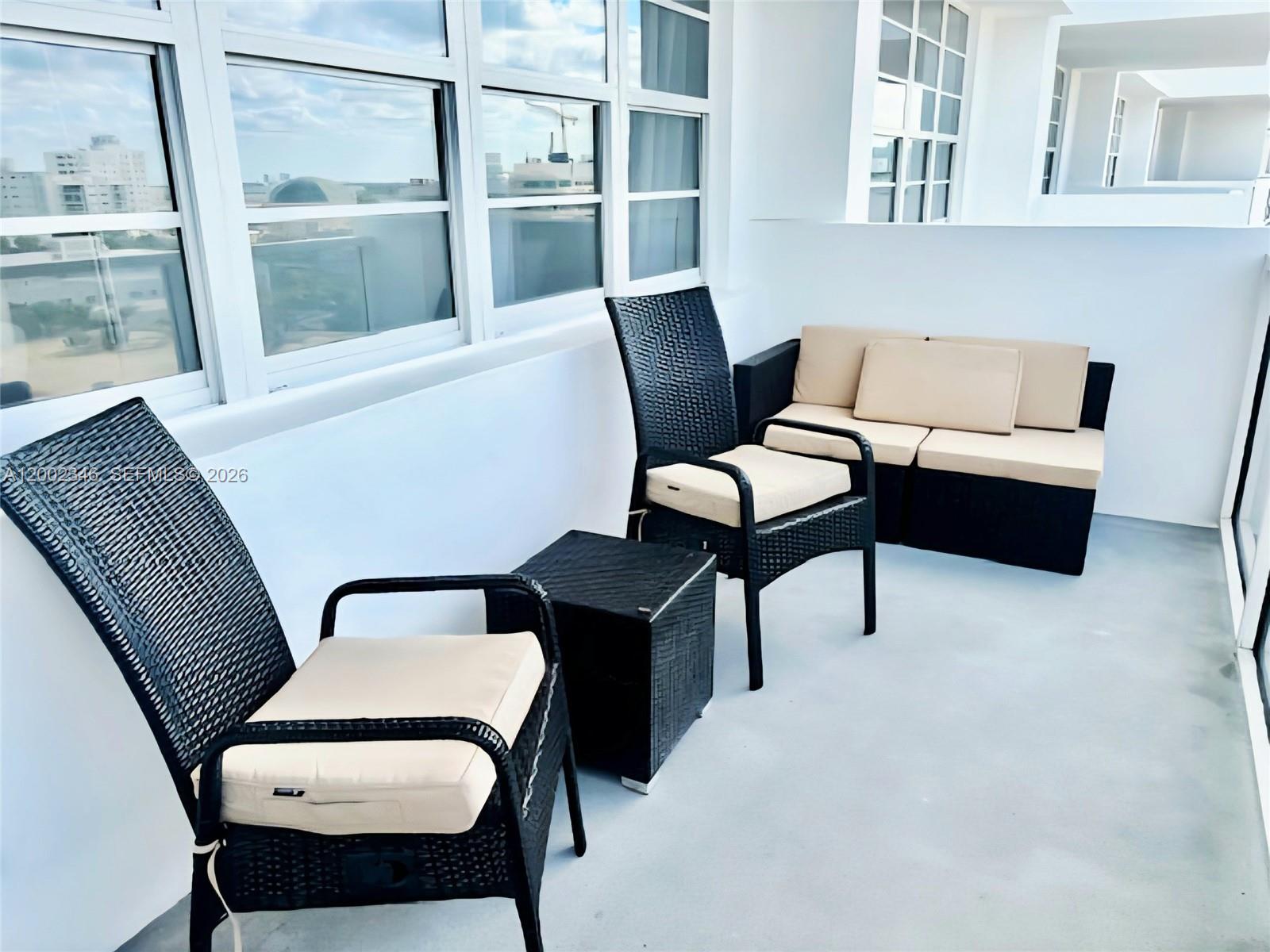 100 Lincoln Road, Unit 927 Miami Beach, FL 33139 - Photo 18 of 42 a living room with furniture and a window