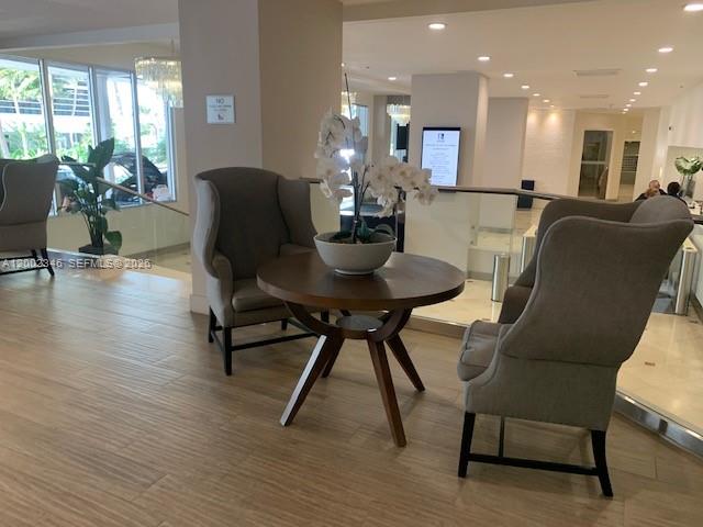 100 Lincoln Road, Unit 927 Miami Beach, FL 33139 - Photo 27 of 42 a dining room with furniture and wooden floor
