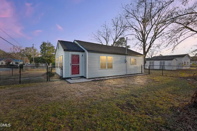 a view of a backyard with large trees