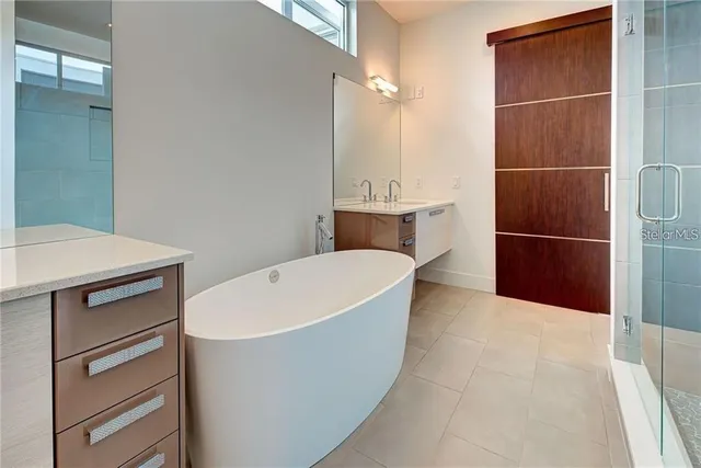 a white bath tub sitting in a bathroom