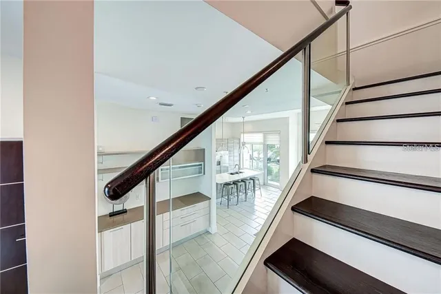 a kitchen with a sink a counter space cabinets and appliances