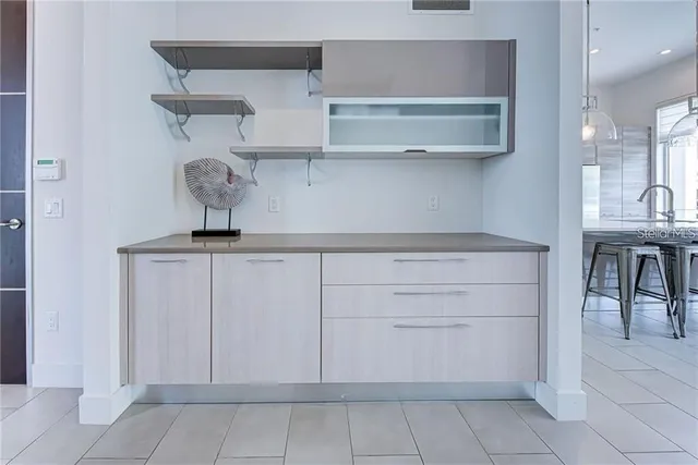 a kitchen with a cabinets and a table