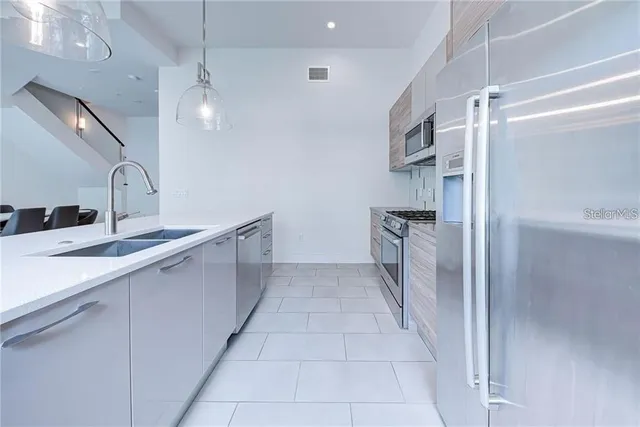 a bathroom with a sink a mirror and shower