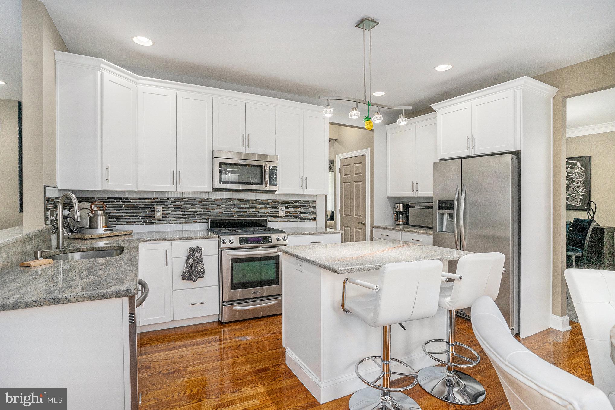 472 Evansburg Road Collegeville, PA 19426 - Photo 12 of 48 a kitchen with stainless steel appliances granite countertop a stove refrigerator sink and microwave