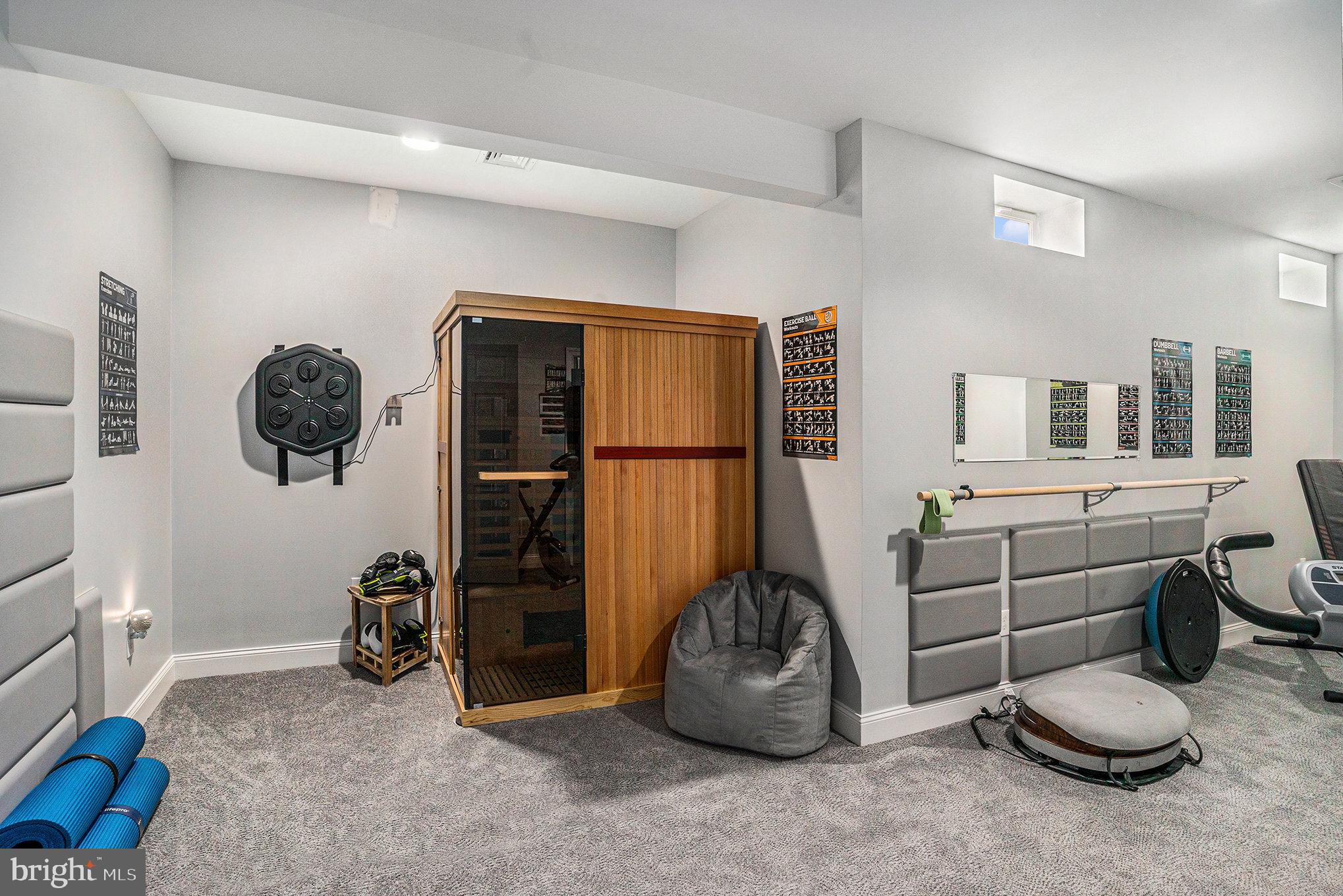 472 Evansburg Road Collegeville, PA 19426 - Photo 22 of 48 a room with gym equipment and mirrors