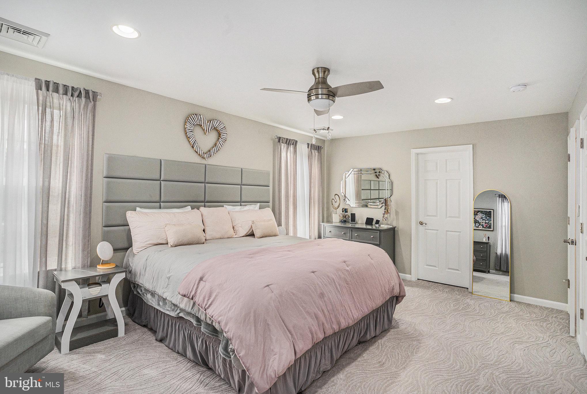 472 Evansburg Road Collegeville, PA 19426 - Photo 24 of 48 a bedroom with a large bed and a chandelier