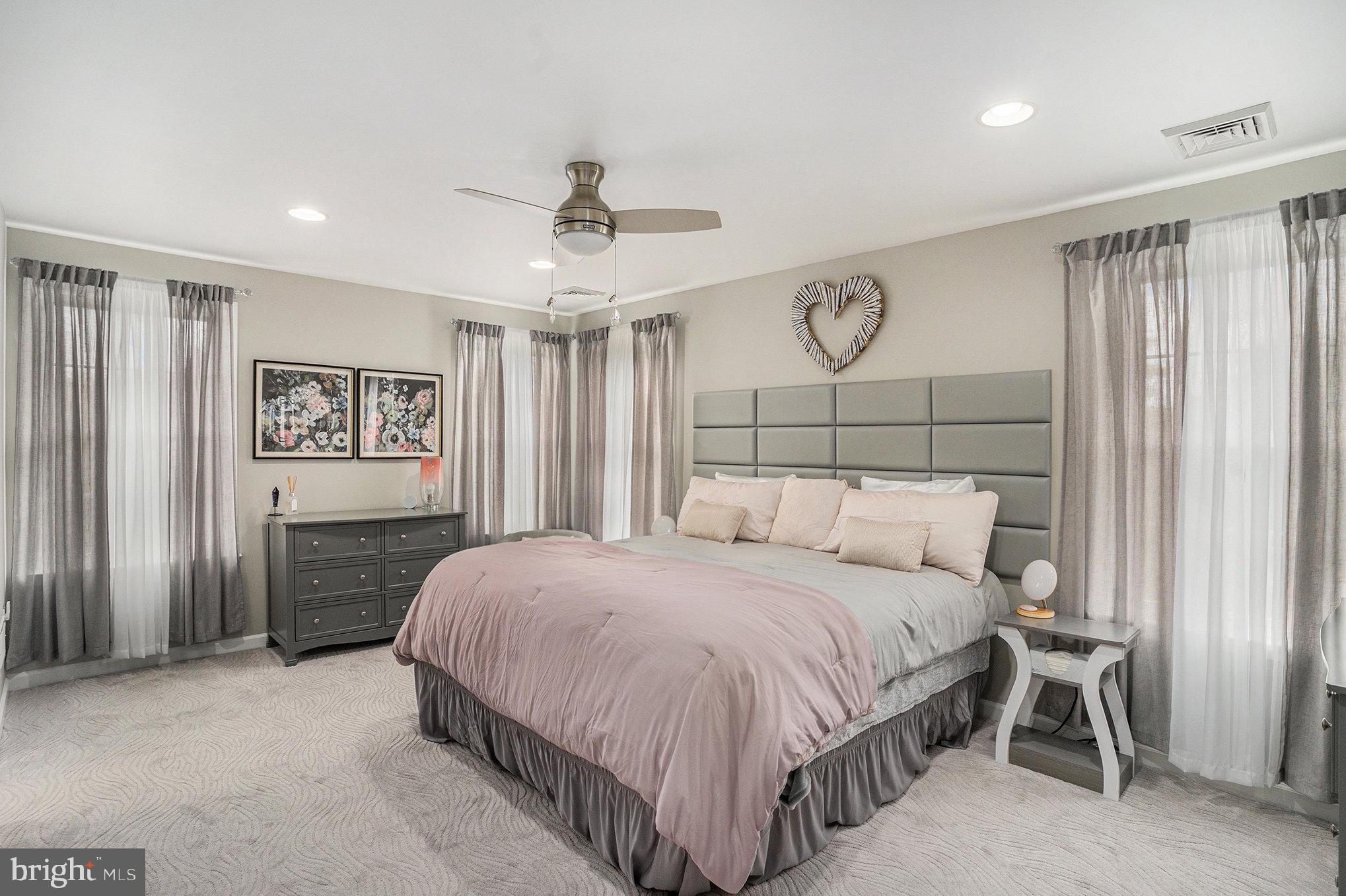 472 Evansburg Road Collegeville, PA 19426 - Photo 25 of 48 a bedroom with a large bed and a chandelier