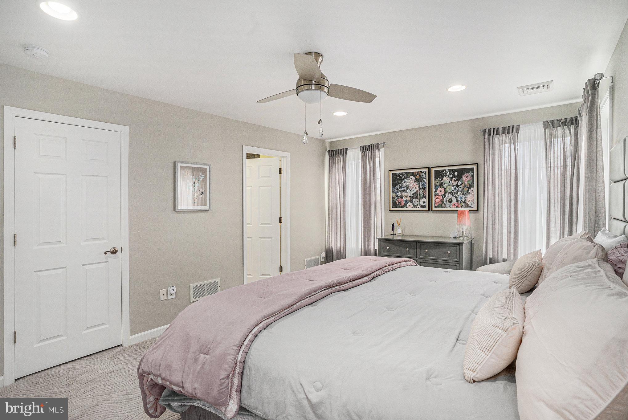 472 Evansburg Road Collegeville, PA 19426 - Photo 26 of 48 a bedroom with a large bed and a chandelier