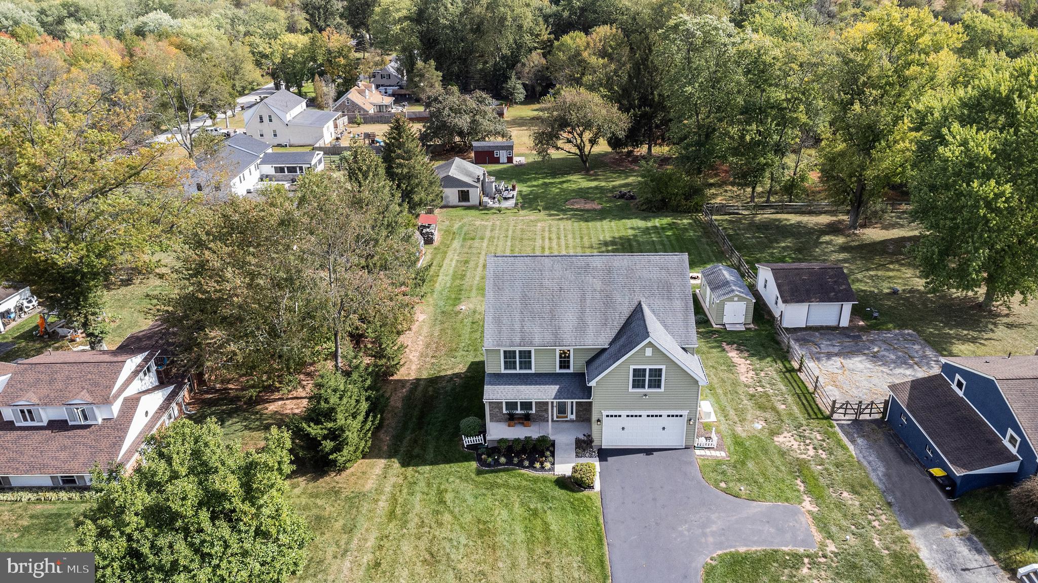 472 Evansburg Road Collegeville, PA 19426 - Photo 3 of 48 an aerial view of a house with a big yard and large trees